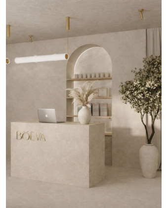 RAYS' minimalist reception desk with a travertine texture in the beauty salon