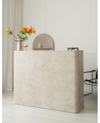 Rounded stone reception desk for a showroom