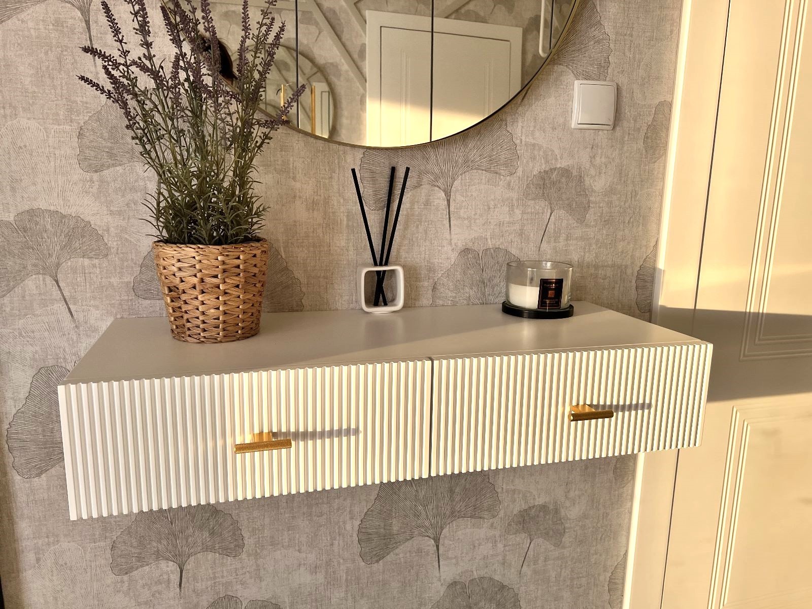 Beige wall console with drawers and decorative grooves—a minimalist piece of furniture for premium interiors